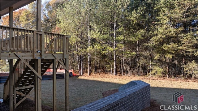 view of yard with a wooden deck