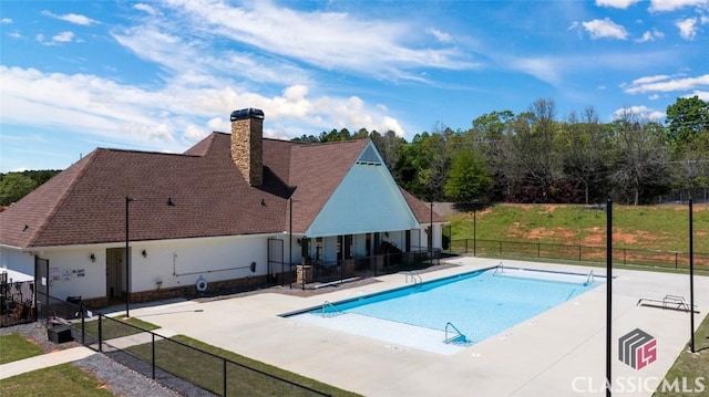 view of swimming pool with a patio area