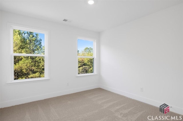 unfurnished room featuring carpet flooring