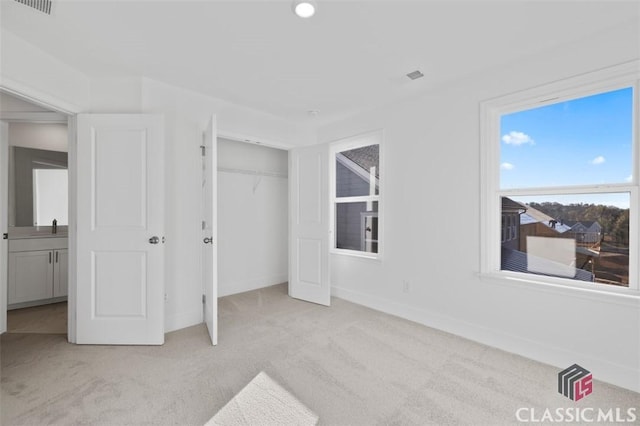 carpeted bedroom with a closet