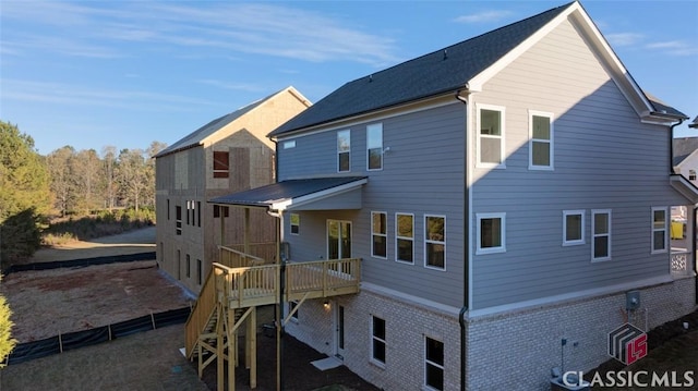 rear view of property with a deck