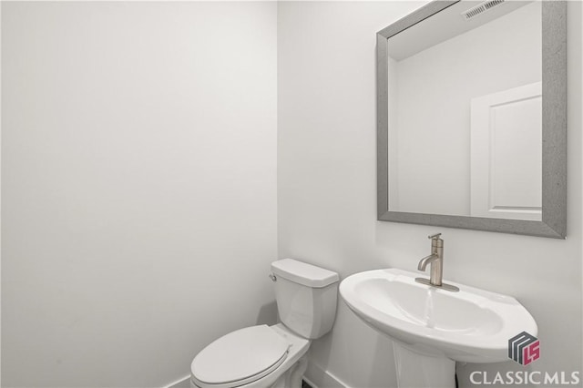 bathroom featuring sink and toilet