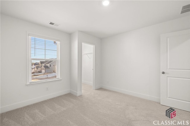 empty room with light colored carpet