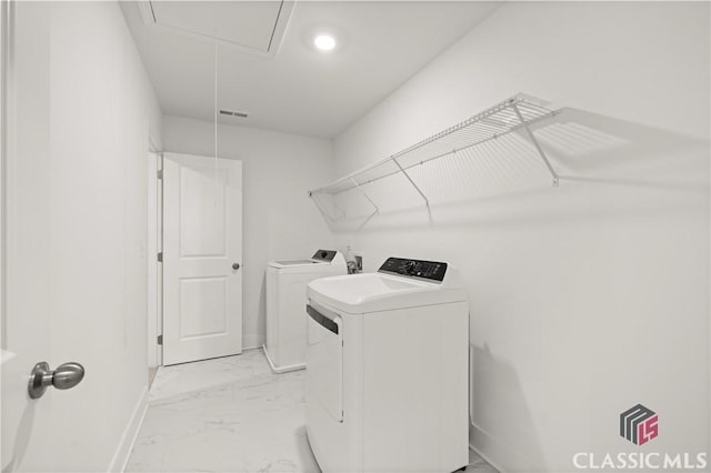 washroom with washer and clothes dryer