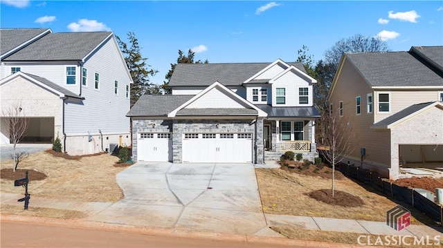 craftsman inspired home with a garage and covered porch