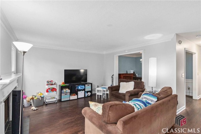 living room with dark wood-type flooring and ornamental molding