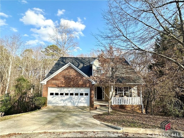 view of front of house featuring a porch and a garage