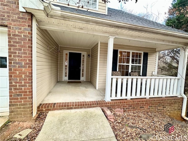 entrance to property featuring a porch