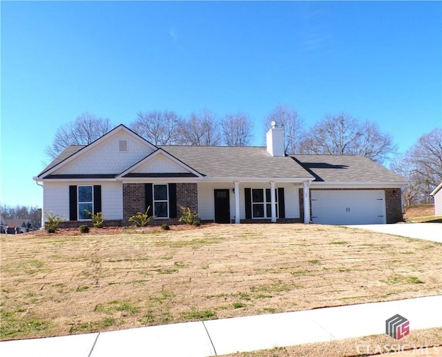 ranch-style home with a garage and a front lawn