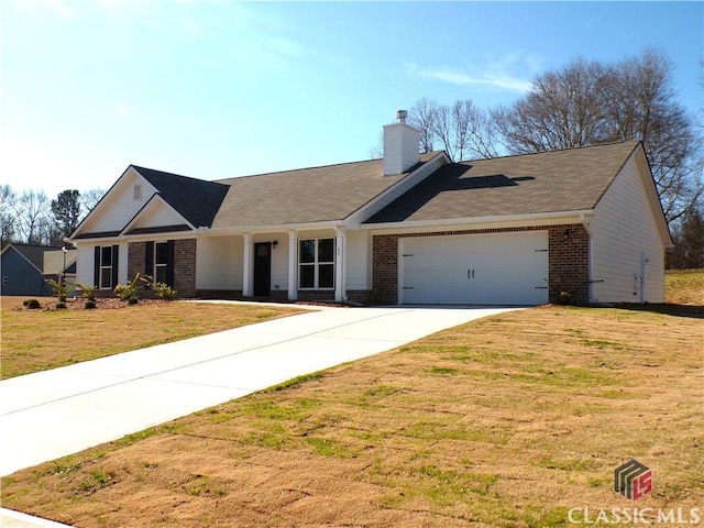 single story home featuring a garage and a front yard