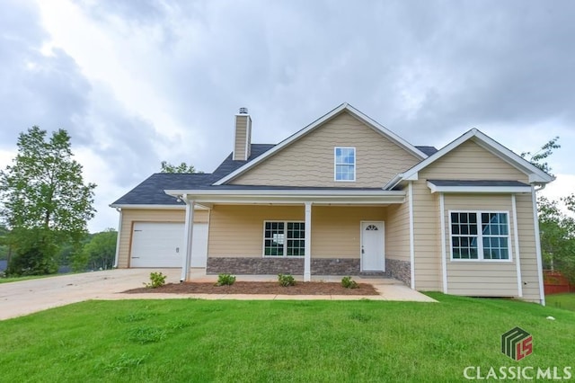 view of front facade featuring a garage, covered porch, and a front lawn