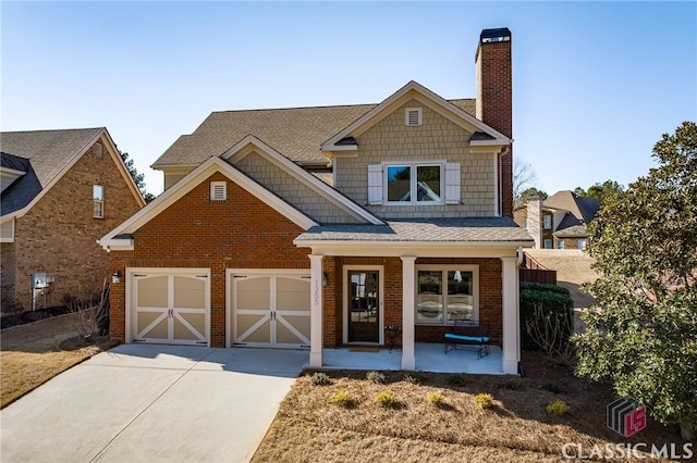 craftsman house featuring a garage and covered porch