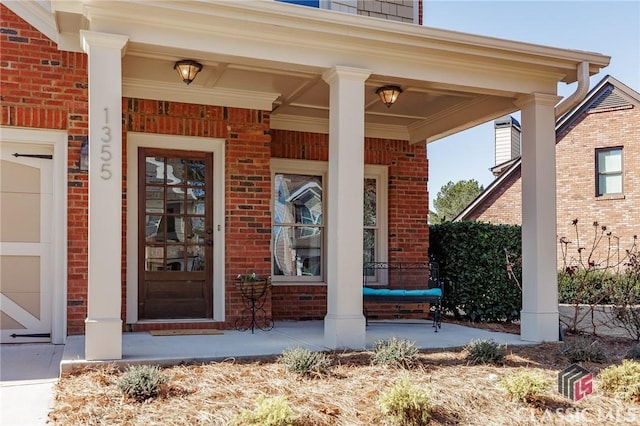 entrance to property with a porch