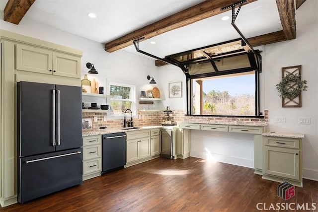 kitchen featuring high end fridge, sink, light stone counters, black dishwasher, and green cabinets