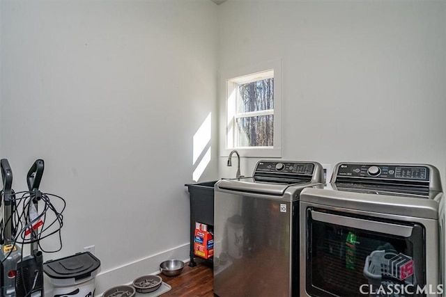 washroom featuring separate washer and dryer and hardwood / wood-style floors