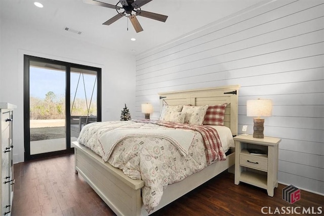 bedroom featuring access to exterior, dark wood-type flooring, and ceiling fan