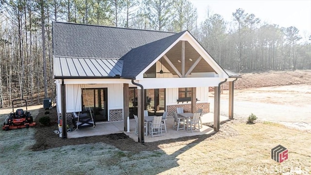 back of property featuring central AC unit and a patio area