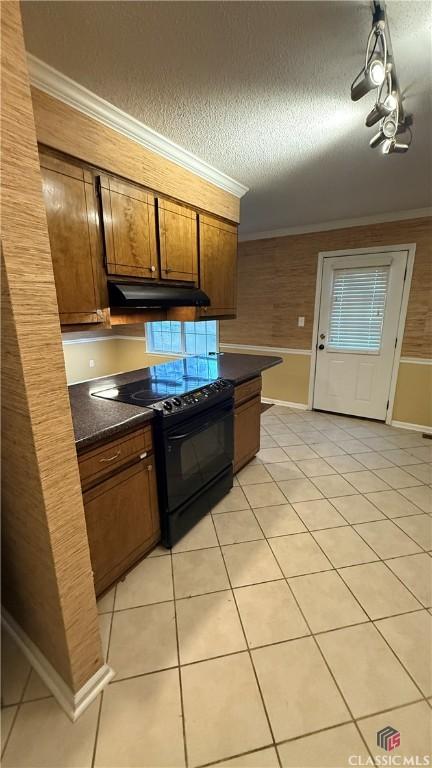 kitchen featuring black range with electric cooktop, crown molding, a textured ceiling, and light tile patterned flooring