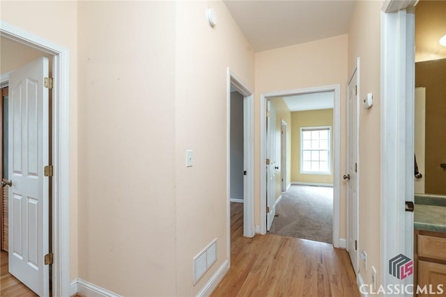 corridor featuring light hardwood / wood-style flooring