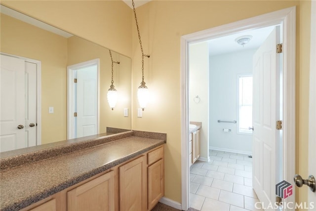 bathroom with vanity and tile patterned floors