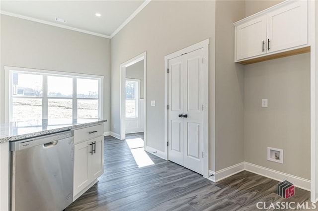 kitchen with white cabinetry, dark hardwood / wood-style floors, light stone countertops, ornamental molding, and stainless steel dishwasher