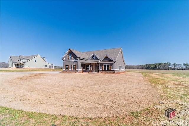 view of front of house with board and batten siding and covered porch