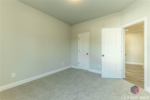 unfurnished bedroom featuring carpet