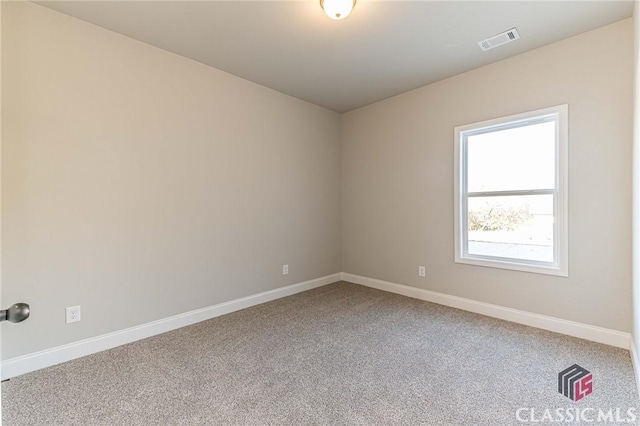 view of carpeted spare room