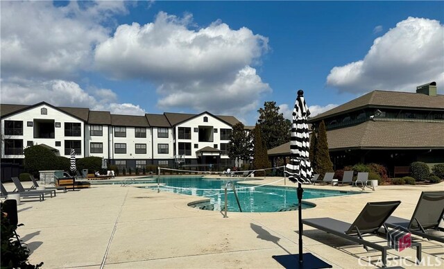 view of swimming pool with a patio