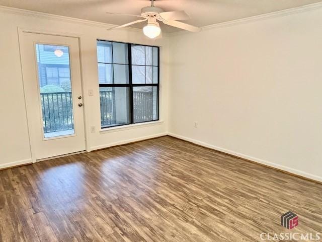 interior space with dark hardwood / wood-style floors, ceiling fan, and ornamental molding