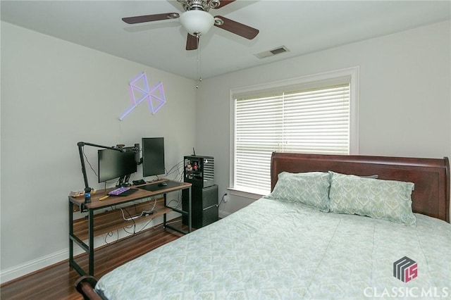 bedroom featuring ceiling fan and dark hardwood / wood-style floors