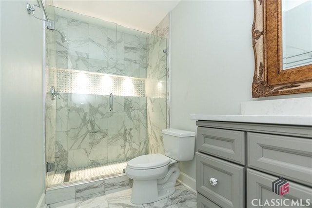 bathroom with an enclosed shower, vanity, and toilet