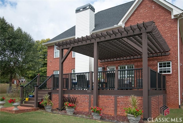 rear view of property with a wooden deck