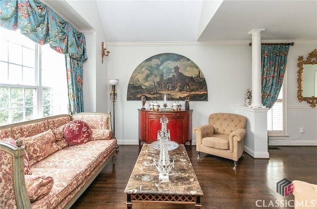 sitting room featuring ornate columns, crown molding, and dark hardwood / wood-style floors