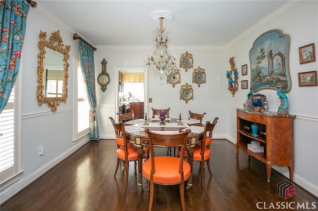 dining area with ornamental molding, dark hardwood / wood-style floors, and a notable chandelier