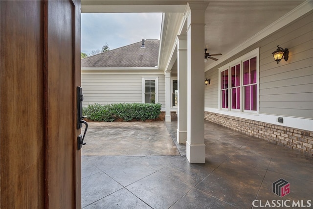 view of patio featuring ceiling fan