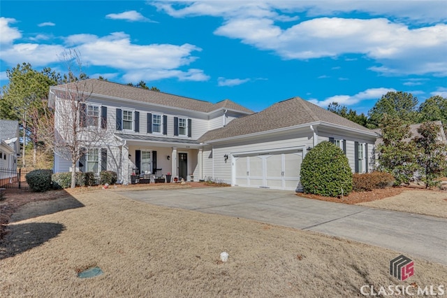 view of front of home featuring a garage and covered porch