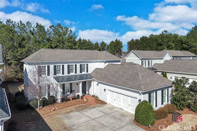 view of front of house with a garage and covered porch