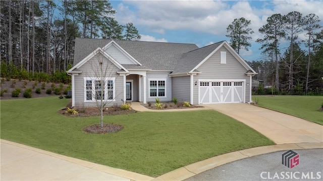 craftsman inspired home with a garage and a front yard