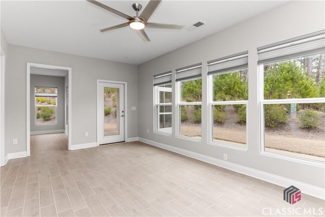 empty room featuring ceiling fan and light wood-type flooring