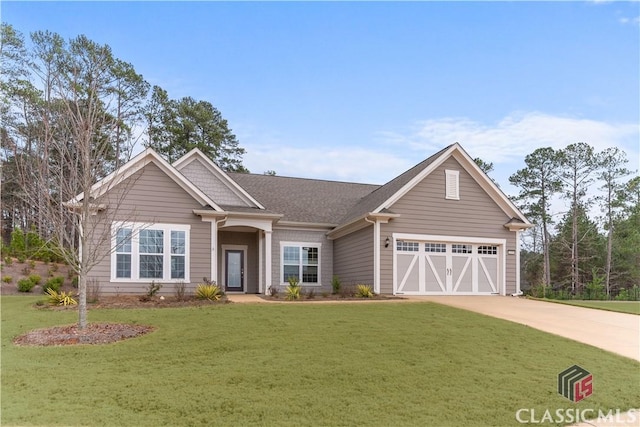 craftsman inspired home featuring a garage and a front yard