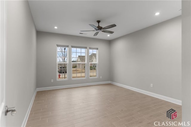 empty room featuring light hardwood / wood-style floors and ceiling fan