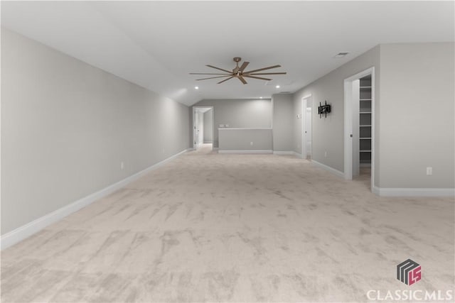 empty room featuring light colored carpet and ceiling fan