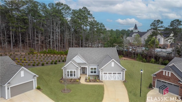 view of front facade with a garage and a front lawn