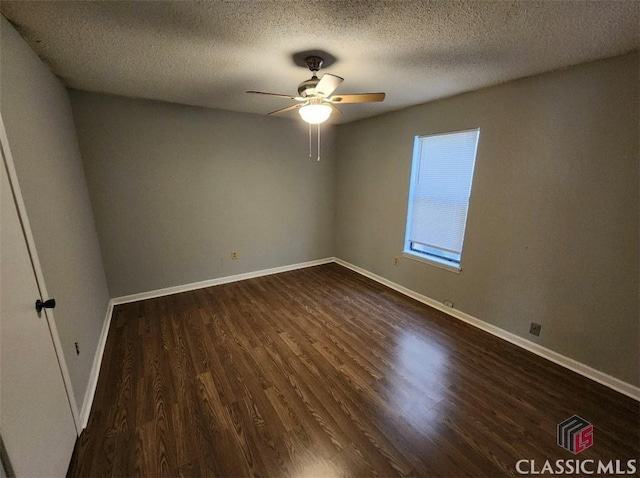 unfurnished room with dark wood-type flooring, a textured ceiling, and ceiling fan