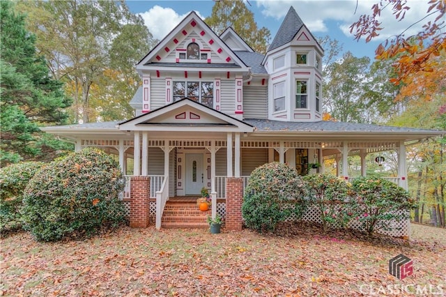 victorian home featuring a porch