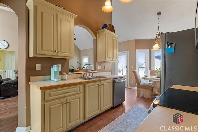 kitchen featuring sink, appliances with stainless steel finishes, dark hardwood / wood-style flooring, pendant lighting, and cream cabinetry