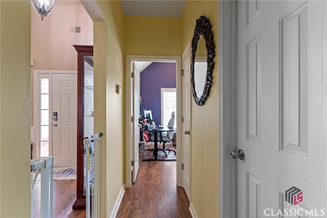 hallway featuring dark wood-type flooring