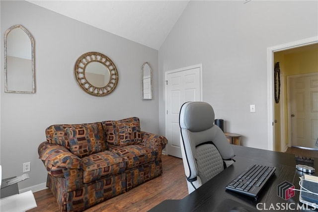 office space featuring lofted ceiling and dark hardwood / wood-style flooring