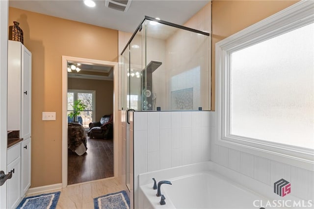 bathroom with vanity and plus walk in shower